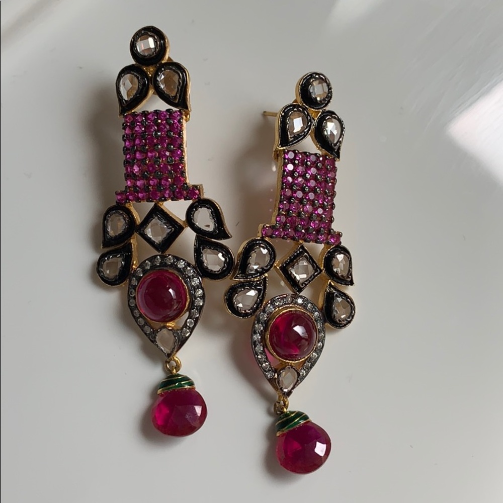 Hot pink golden earrings.